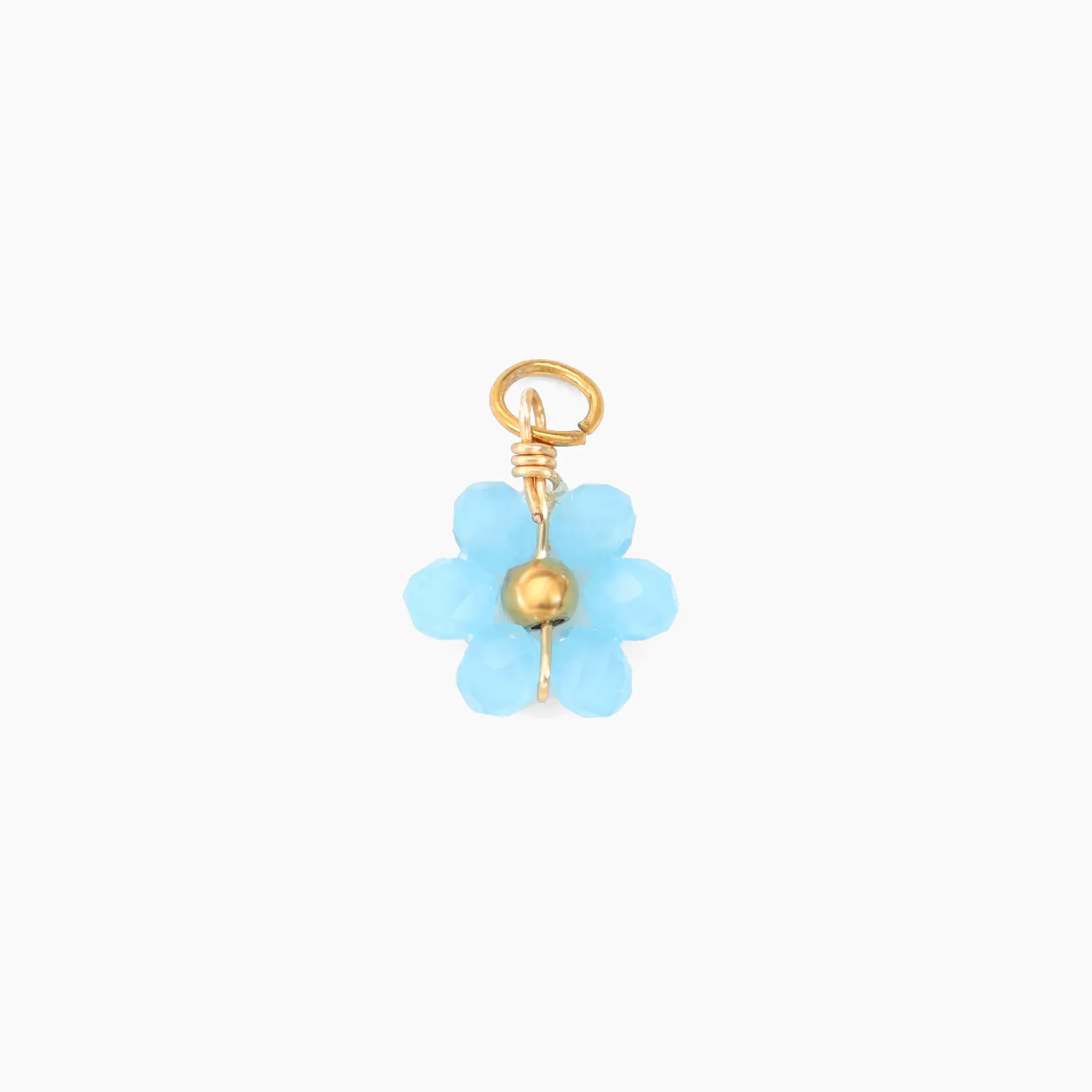 Blue flower-shaped charm with gold accents on a white background