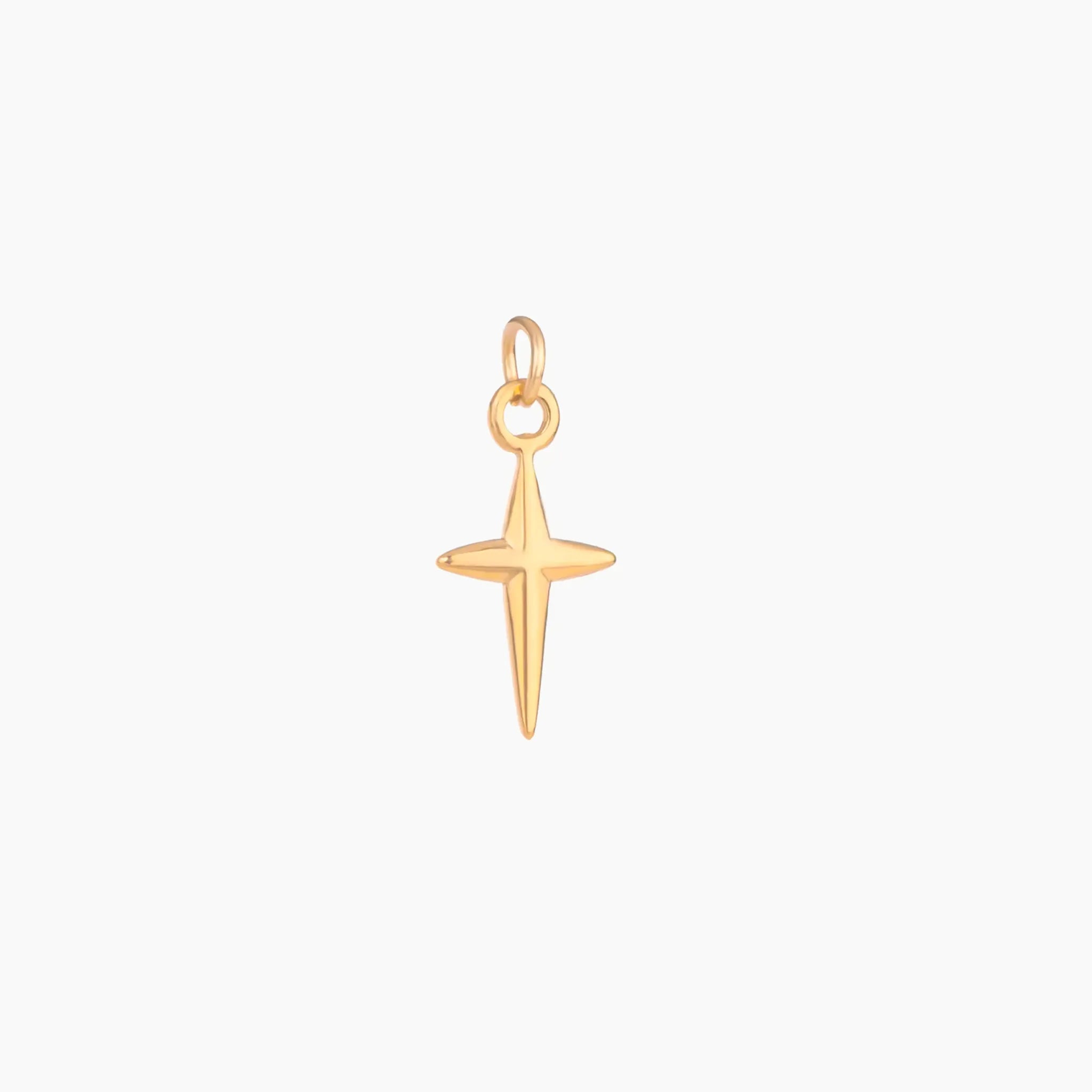 Golden cross pendant on a white background