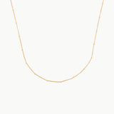 gold choker with tiny spaced beads on fine chain