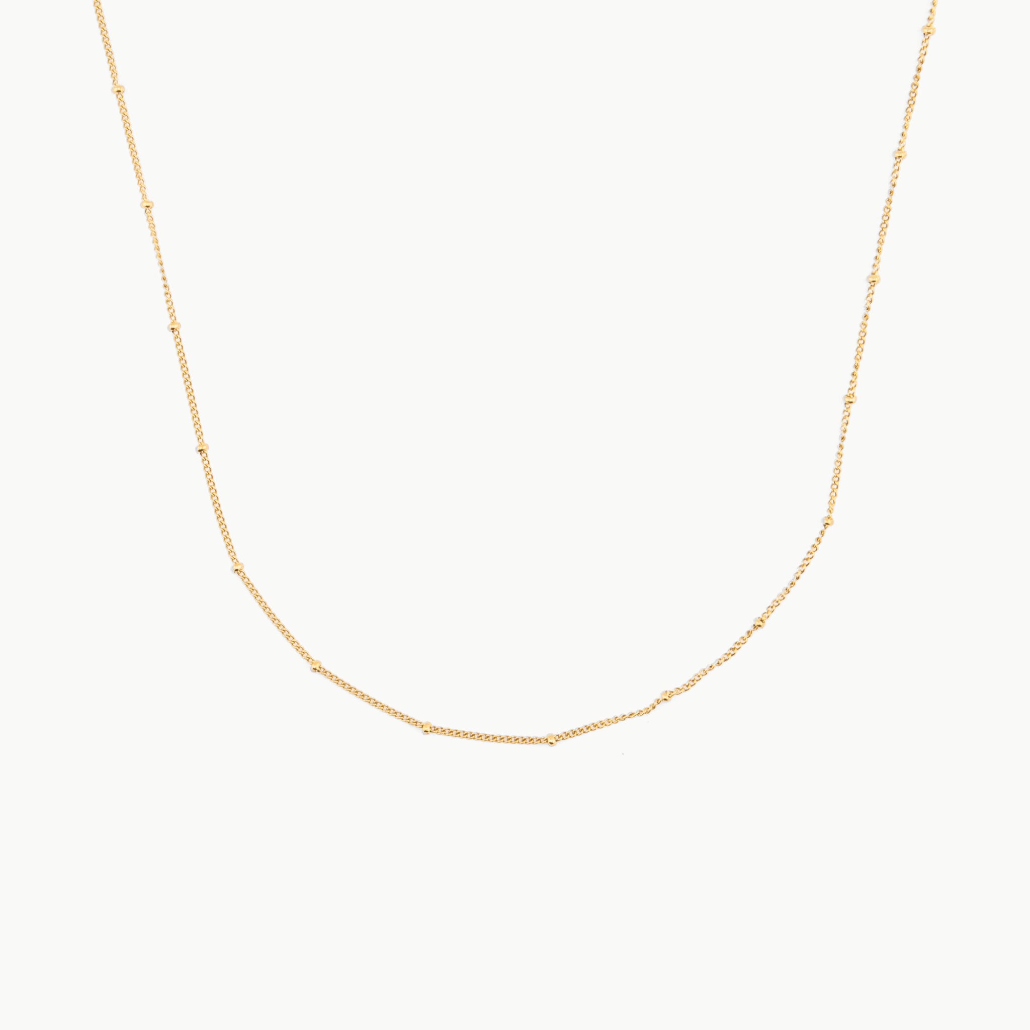 gold choker with tiny spaced beads on fine chain