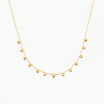 gold beaded drop necklace in stainless steel, dainty and elegant design