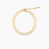 gold chain bracelet with round textured disc charms