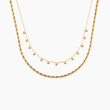 Two golden necklaces on a white background