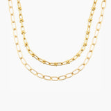 Two gold chain necklaces on a white background