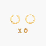 Gold hoop earrings and XO letter earrings on a white background