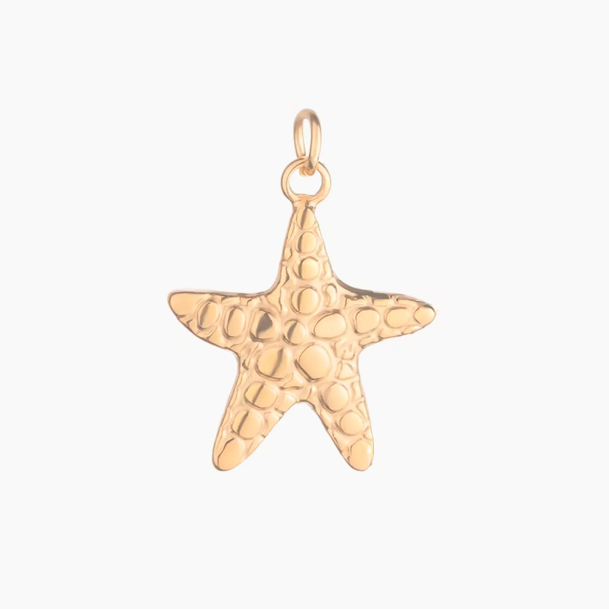 Golden large starfish pendant on a white background