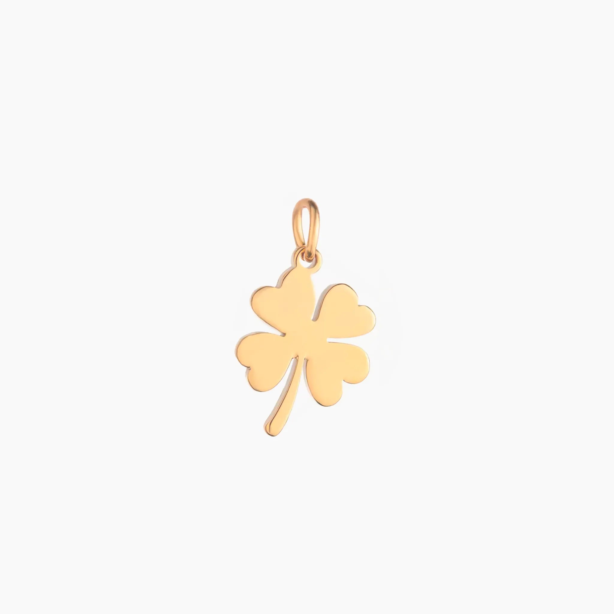 Gold four-leaf clover pendant on a white background