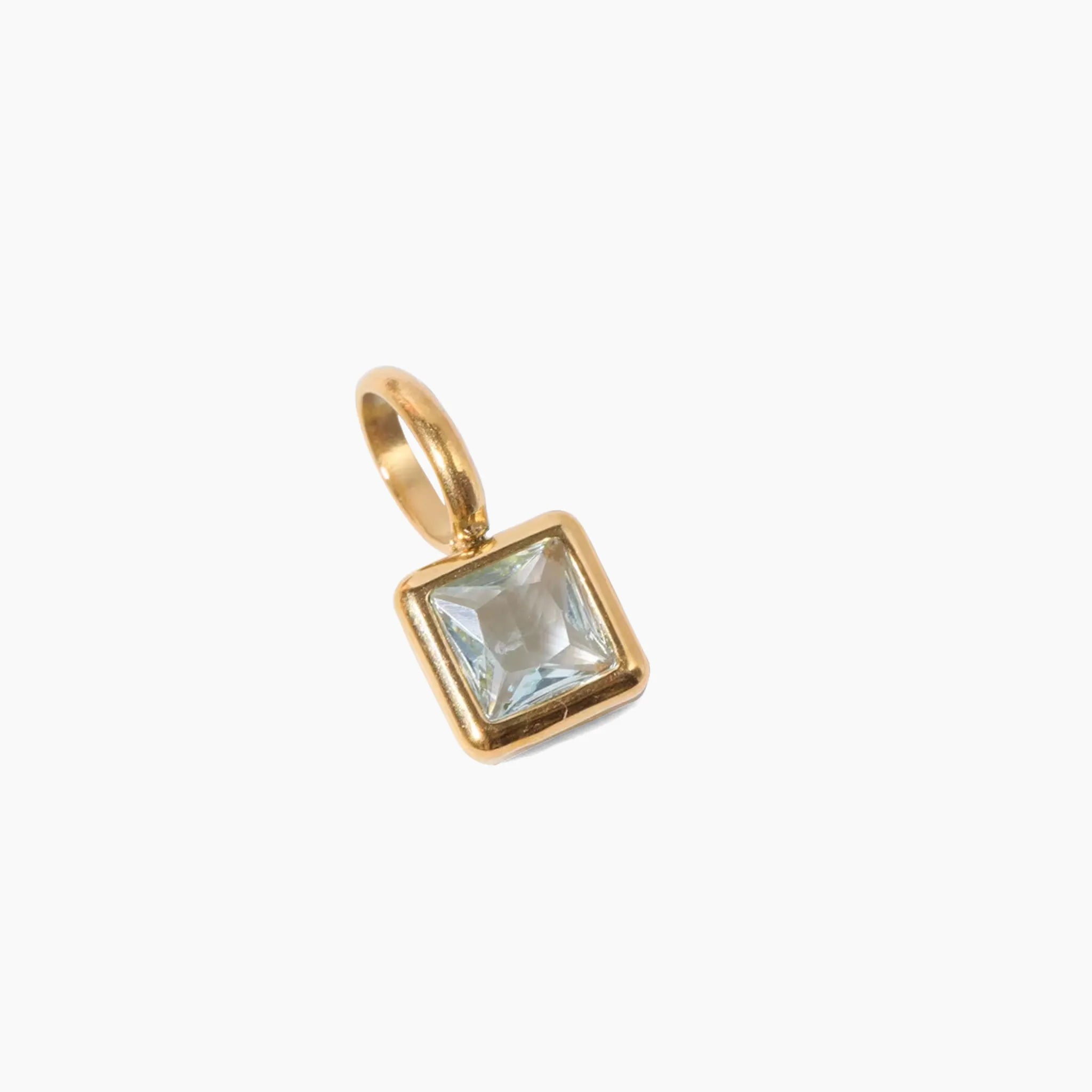 March birthstone charm, golden pendant with a clear gemstone on a white background