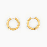 pair of gold hoop earrings with small white pearl accents