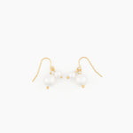 pair of gold hook earrings with two suspended white pearls