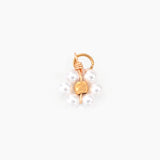 Pearl flower charm on a white background