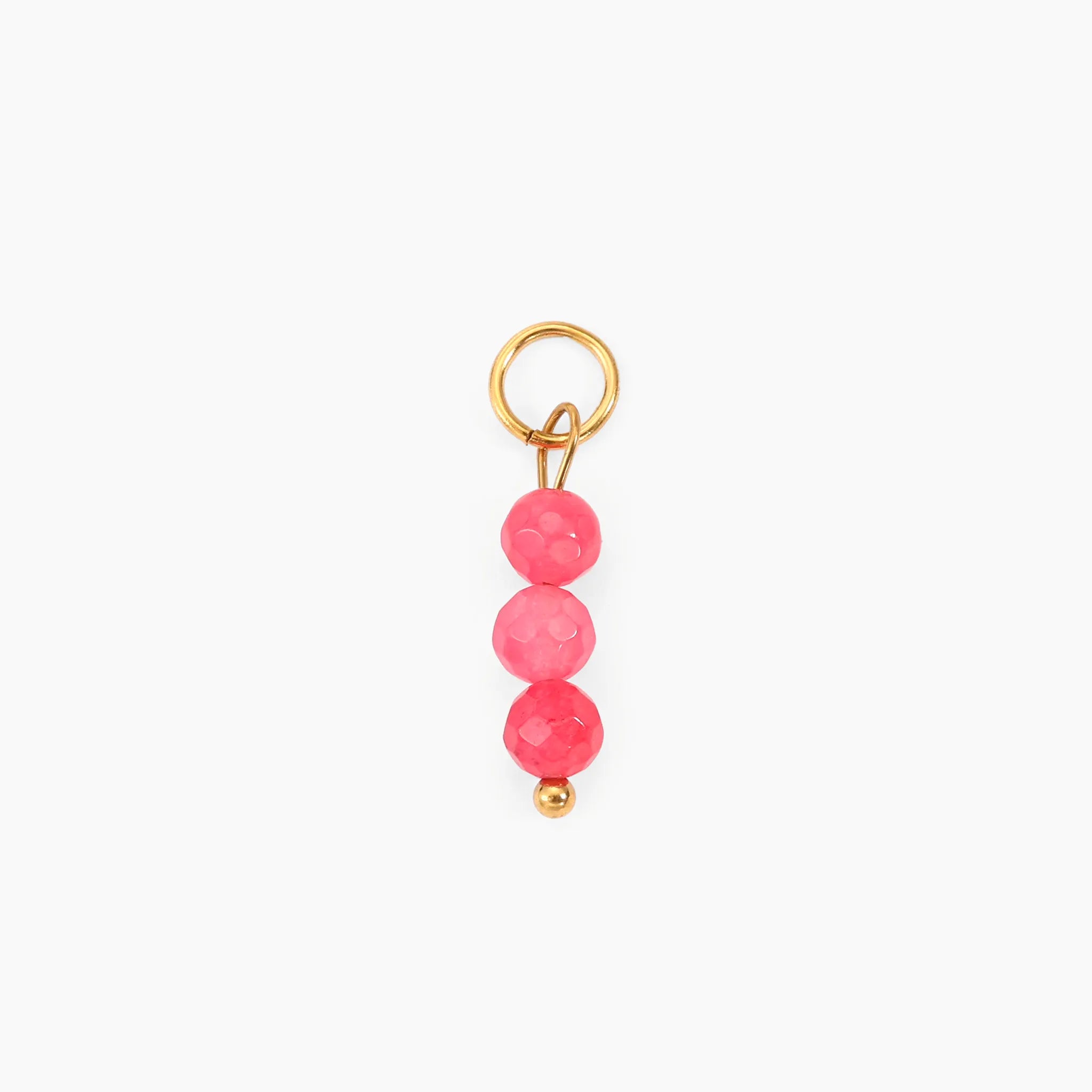 Golden charm with pink beads on a white background