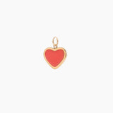 Heart-shaped pendant with red center and golden border on a white background