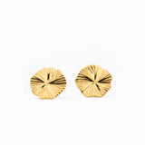 pair of gold sculptural earrings with textured petal-inspired shape