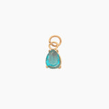 Golden pendant with a turquoise drop on a white background
