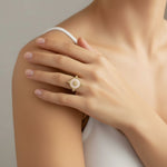 a woman wearing a symbolic charm ring